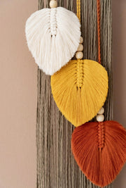 Small wall hanging with feathers