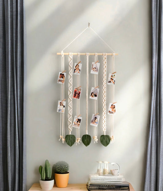 Bohemian-style macramé wall holder  with multiple rows for displaying polaroid photos and prints