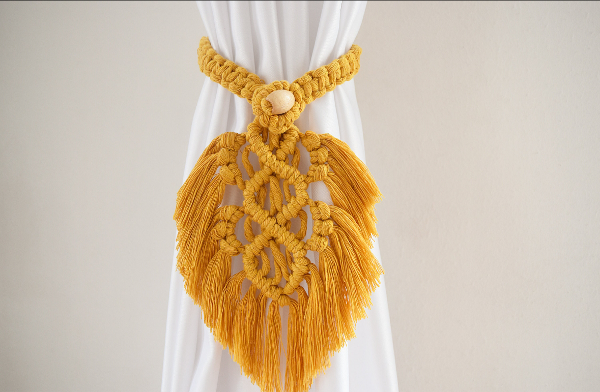 Feather curtain holder